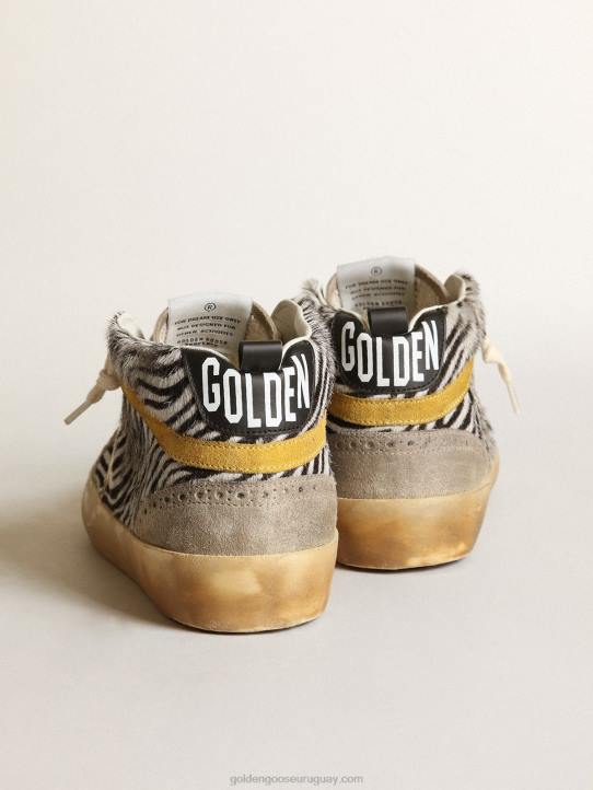 mujer Deportivas mid star de piel de potro con estampado de cebra, estrella de piel metalizada dorada y destello de ante color mostazaGolden Goose 02H622