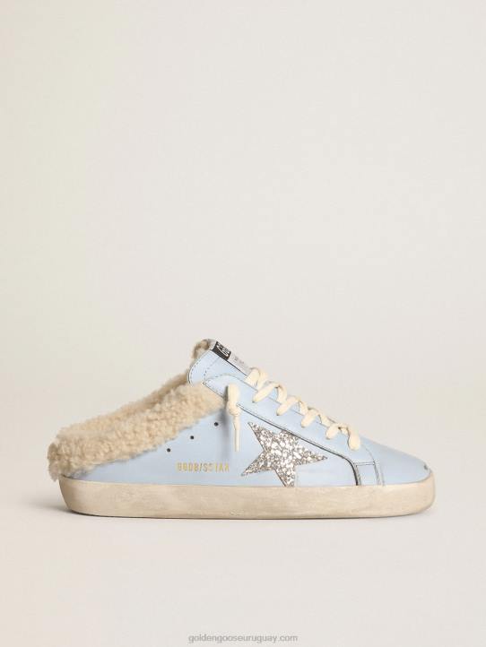mujer zuecos superestrella de piel azul claro con estrella de purpurina plateada y forro de borrego beigeGolden Goose 02H6274
