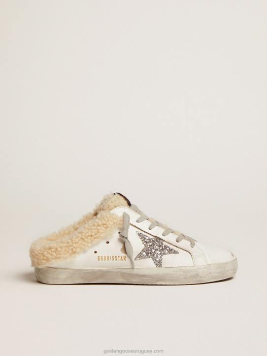 mujer zuecos superestrella de piel blanca con estrella de purpurina plateada y forro de borregoGolden Goose 02H6117