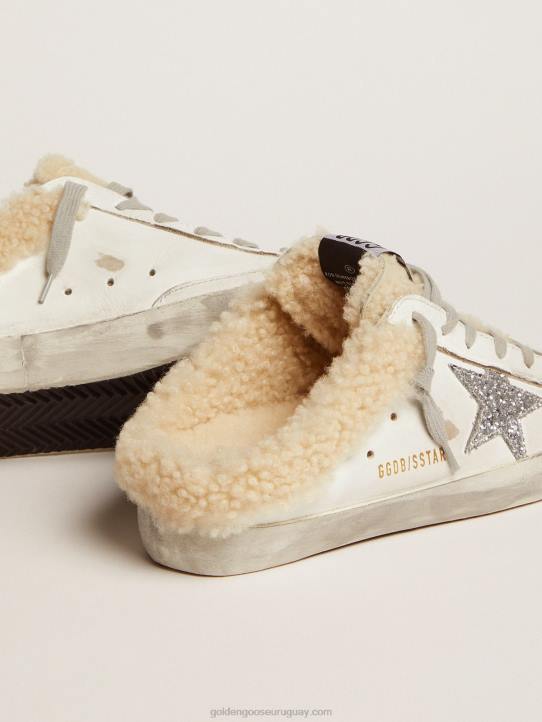 mujer zuecos superestrella de piel blanca con estrella de purpurina plateada y forro de borregoGolden Goose 02H6117
