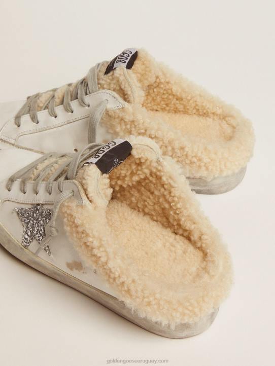 mujer zuecos superestrella de piel blanca con estrella de purpurina plateada y forro de borregoGolden Goose 02H6117