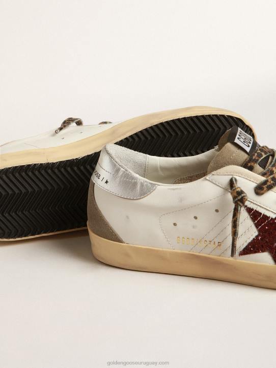 mujer superestrella con estrella burdeos brillante y tira plateada en el talónGolden Goose 02H6255