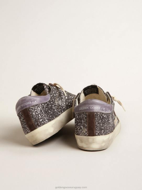 mujer superestrella en purpurina con estrella marrón y tirador lila en el talónGolden Goose 02H6240