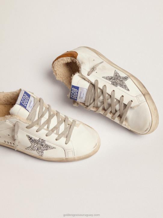 mujer zapatillas deportivas super-star con forro de borrego estrella plateada con purpurina y refuerzo del talón de piel gris tórtola con estampado de lagartosGolden Goose 02H686