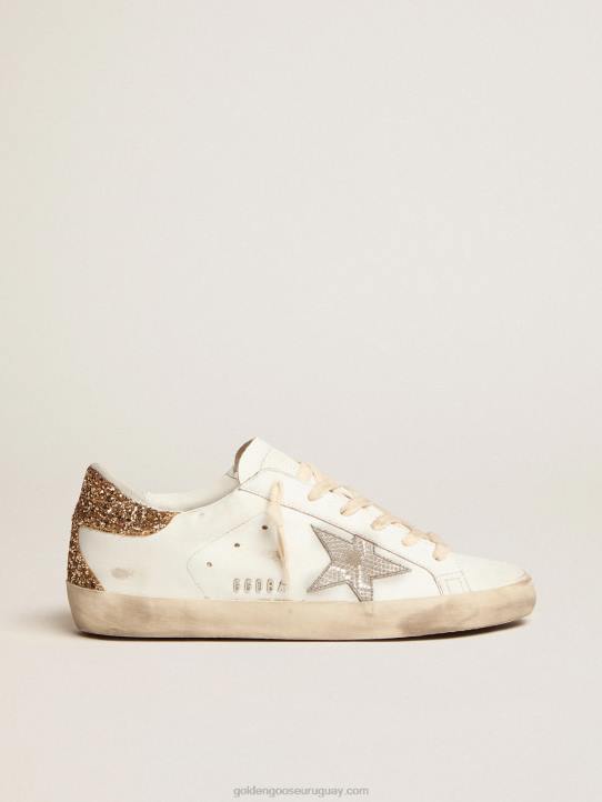 mujer zapatillas super-star con estrella de piel plateada con estampado de serpiente y refuerzo del talón con purpurina doradaGolden Goose 02H66