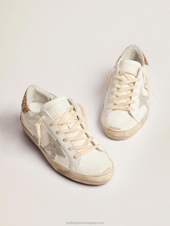 mujer zapatillas super-star con estrella de piel plateada con estampado de serpiente y refuerzo del talón con purpurina doradaGolden Goose 02H66