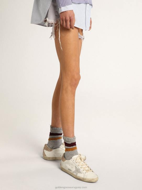 mujer zapatillas super-star con estrella de piel plateada con estampado de serpiente y refuerzo del talón con purpurina doradaGolden Goose 02H66