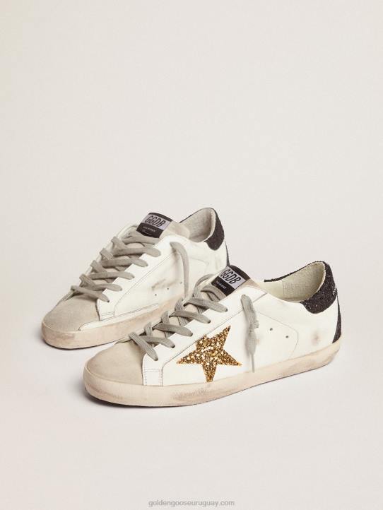 mujer zapatillas super-star con estrella dorada y refuerzo negro brillante en el talónGolden Goose 02H6277