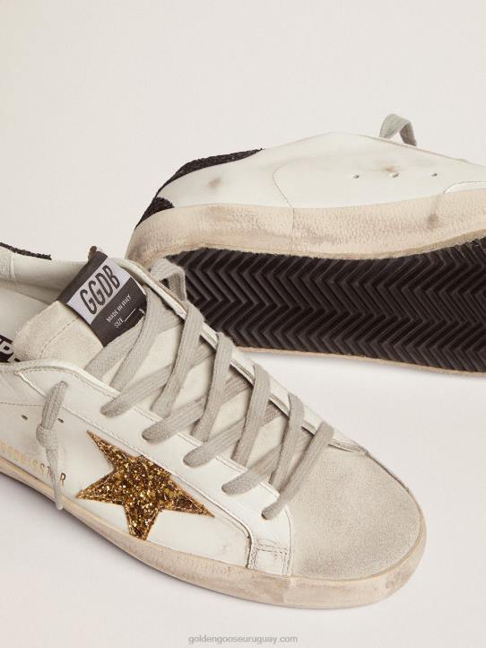 mujer zapatillas super-star con estrella dorada y refuerzo negro brillante en el talónGolden Goose 02H6277
