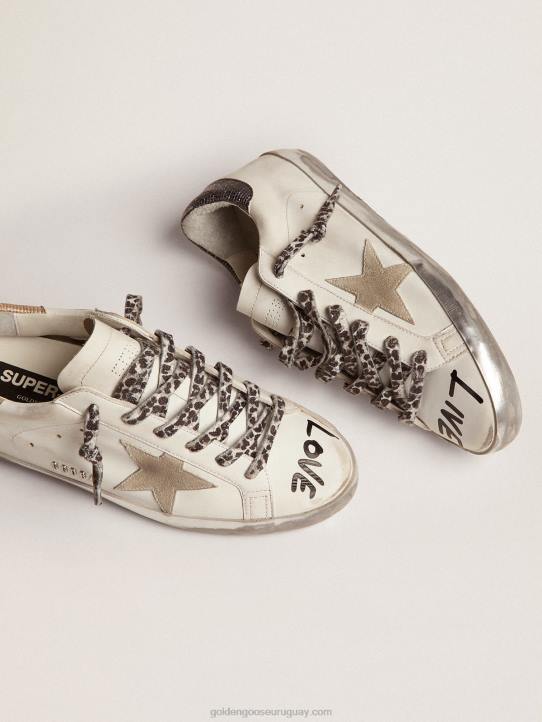 mujer zapatillas super-star de piel blanca con estrella de ante gris hielo y letras negras en contrasteGolden Goose 02H646