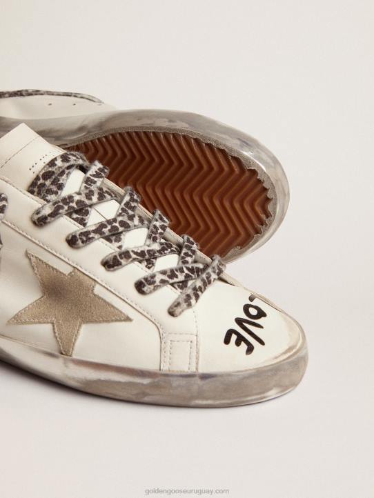 mujer zapatillas super-star de piel blanca con estrella de ante gris hielo y letras negras en contrasteGolden Goose 02H646